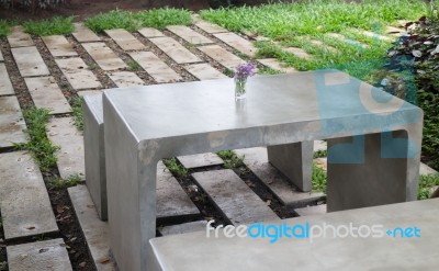 Concrete Outdoor Furniture Set In The Small Garden Stock Photo