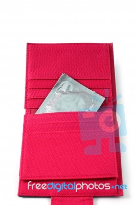 Condom In Pink Wallet Stock Photo