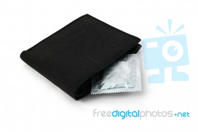 Condoms In Black Wallet Stock Photo