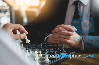 Confident Businessman Colleagues Playing Chess With Colleague To… Stock Photo
