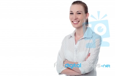 Confident Businesswoman With Folded Arms Stock Photo