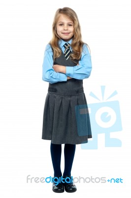 Confident School Girl In Pinafore Uniform Stock Photo