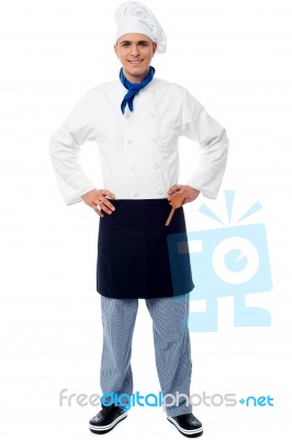 Confident Young Cook Posing In Uniform Stock Photo Confident Young Cook Posing In Uniform Stock Photo