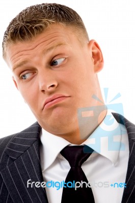 Confused Businessman Looking Aside Stock Photo