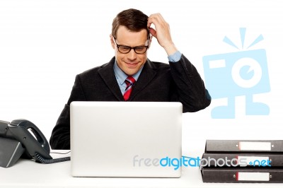 Confused Male Manager Itching His Head Stock Photo