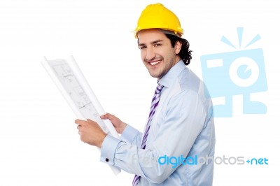 Construction Engineer Studying The Plan Stock Photo