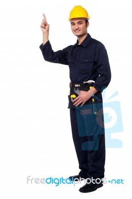 Construction Worker Pointing Upwards Stock Photo