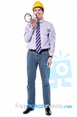 Construction Worker With A Megaphone Stock Photo