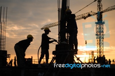 Construction Workers At Site Stock Photo