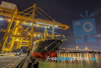 Container Cargo Freight Ship With Working Crane Loading Stock Photo
