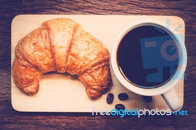 Continental Breakfast With Coffee And Croissant Stock Photo