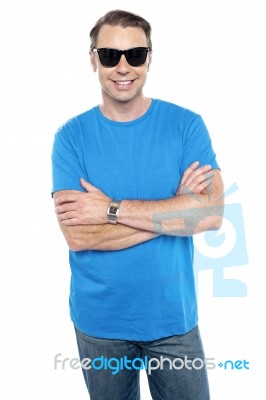 Cool Dude Wearing Goggles, Posing With Arms Crossed Stock Photo