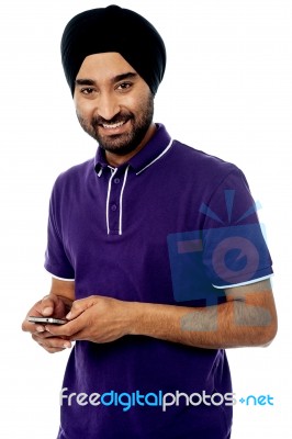 Cool Young Man Using Mobile Phone Stock Photo