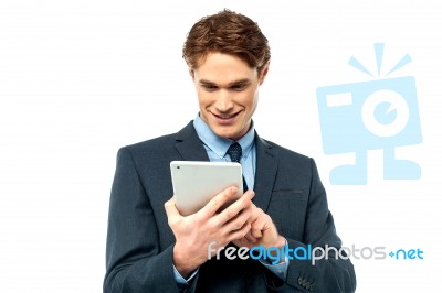 Corporate Guy Browsing On His Tablet Pc Stock Photo