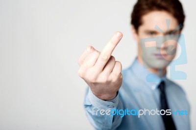 Corporate Guy Showing Middle Finger Stock Photo