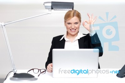 Corporate Lady Showing Excellent Gesture Stock Photo