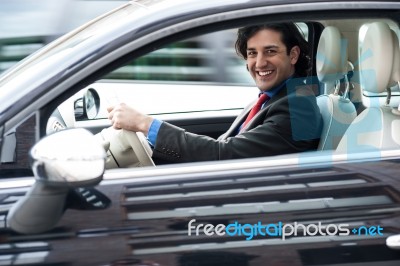 Corporate Man Driving His Car Stock Photo