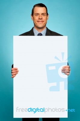 Corporate Man Holding Big White Blank Billboard Stock Photo