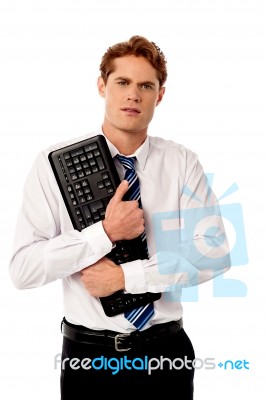 Corporate Man Holding Keyboard Stock Photo