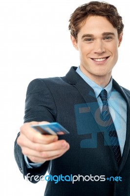 Corporate Man Offering You Credit Card Stock Photo