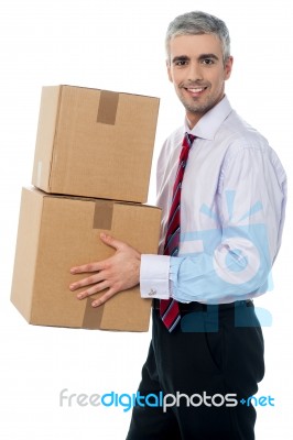 Corporate Man With A Cardboard Box In Hand Stock Photo