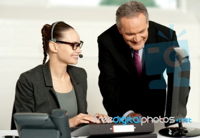 Corporate Team Working Together On Computer Stock Photo