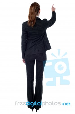 Corporate Woman Pointing At Something Stock Photo