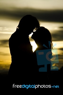 Couple At Sunset Stock Photo