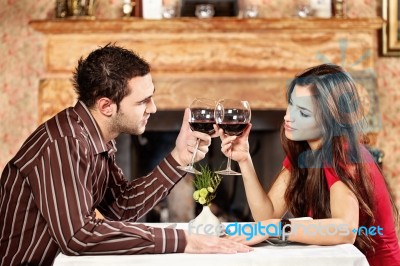 Couple Cheers With Wine Stock Photo