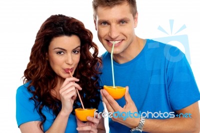 Couple Drinking Orange Juice Stock Photo