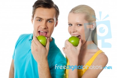 Couple Eating Green Apple Stock Photo