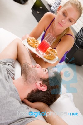 Couple Having Breakfast In Bed Stock Photo