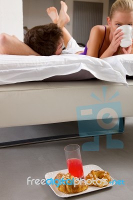 Couple Having Breakfast In Bed Stock Photo