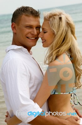 Couple Hugging At Beach Stock Photo