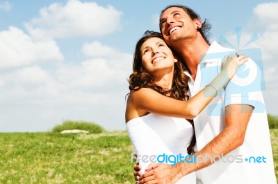Couple Looking At Sky Stock Photo