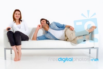 Couple Lying On The Couch Stock Photo