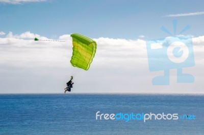 Couple Paragliding Over Atlantic Ocean Towards Playa Del Ingles Stock Photo