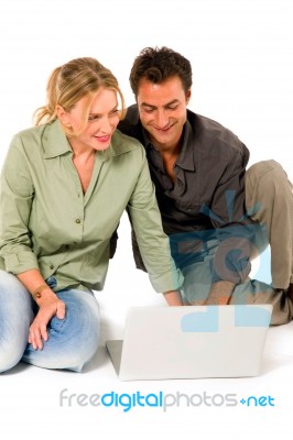 Couple Using Laptop Stock Photo