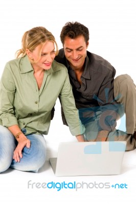 Couple Using Laptop Stock Photo