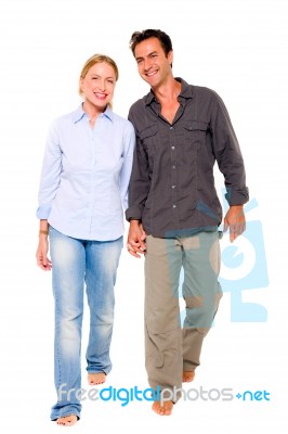 Couple Walking Hand In Hand Stock Photo
