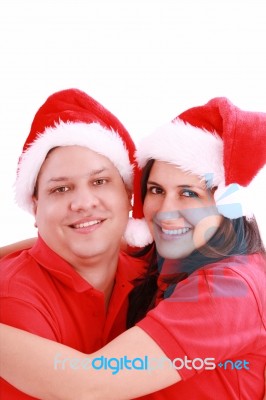 Couple Wearing Santa Hats Stock Photo