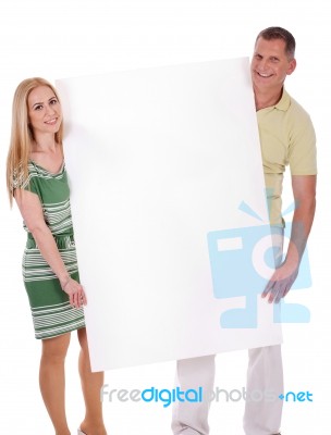 Couple With Blank White Board Stock Photo