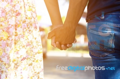 Couples Holding Hands Stock Photo