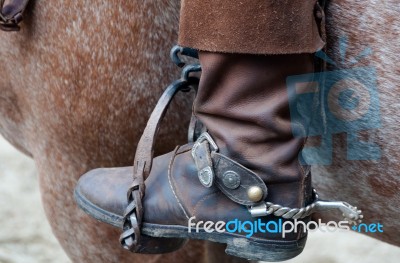 Cowboy Boot With Spur And Horse Stock Photo
