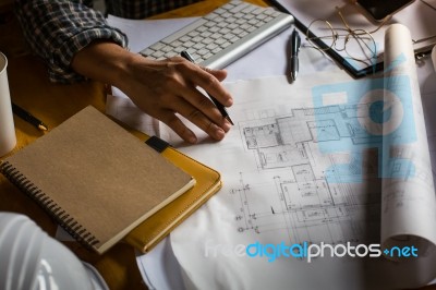 Creative Architect Projecting On The Big Drawings In The Dark Lo… Stock Photo