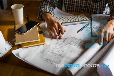 Creative Architect Projecting On The Big Drawings In The Dark Lo… Stock Photo