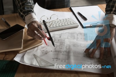 Creative Architect Projecting On The Big Drawings In The Dark Lo… Stock Photo