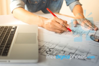 Creative Architect Projecting On The Big Drawings In The Dark Lo… Stock Photo