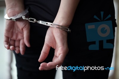 Criminal In Handcuffs Arrested For Crimes Stock Photo
