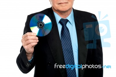 Cropped Image Of A Male Showing Compact Disk Stock Photo